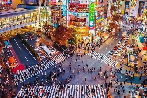 Shibuya Crossing in Tokyo, lit up at night