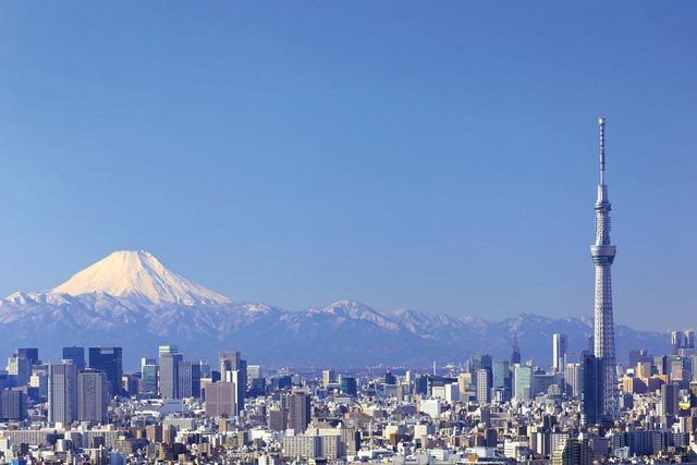 Tokyo skyline with Tokyo Skytree and Mount Fuji behind it